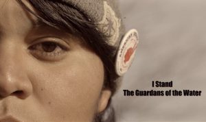 A woman with headphones on her head and the words " i stand in the guardianship of god ".